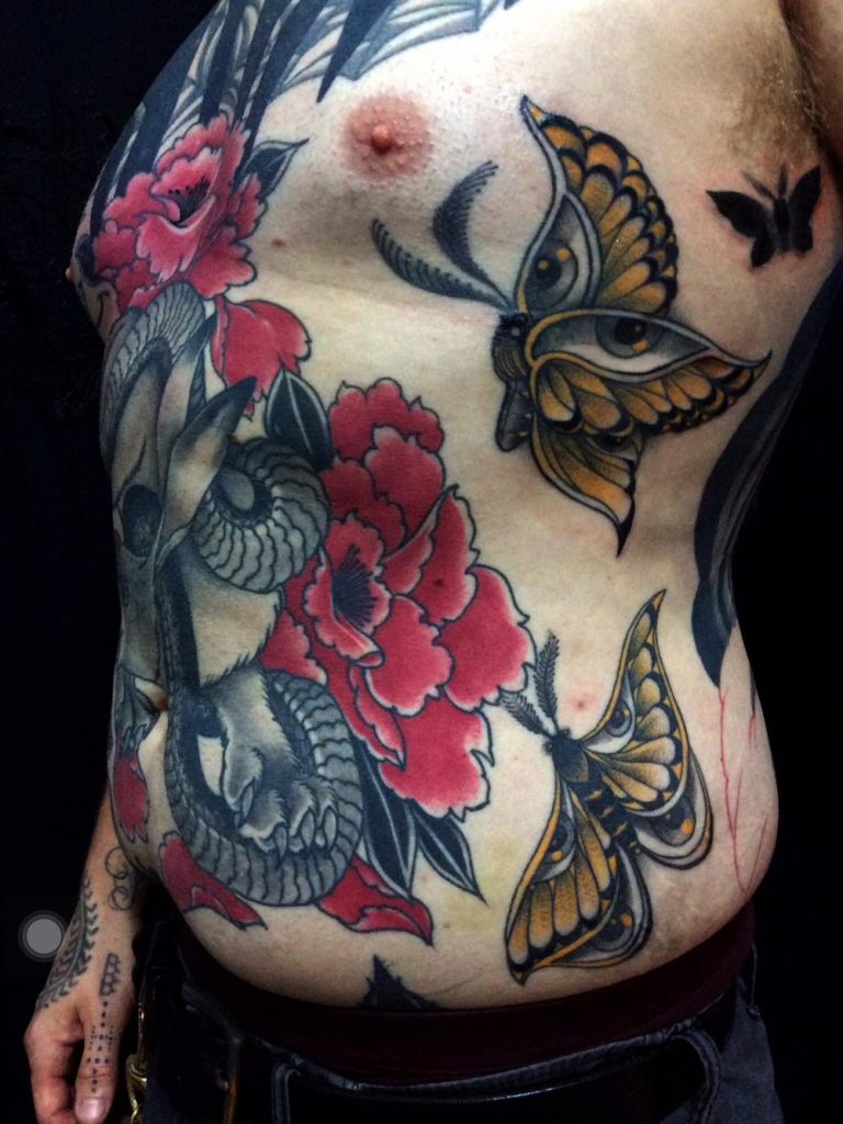 Asian influenced tattoo chaing man